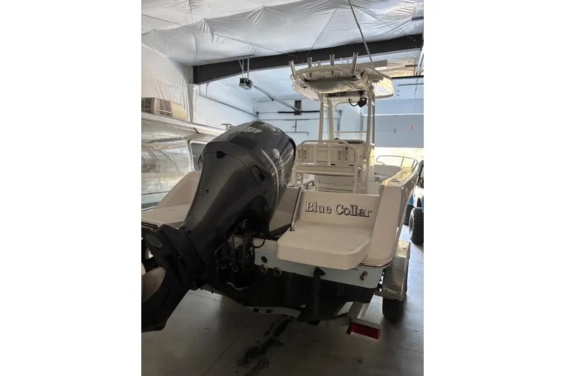 Slide: The Image of 2013 Everglades 230 Center Console boat on trailer in storage. - 2