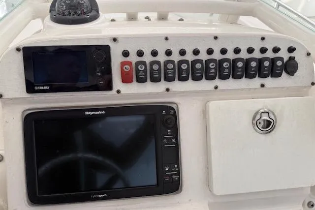 Slide: The Image of 2013 Everglades 230 Center Console dashboard with Yamaha and Raymarine electronics. - 20