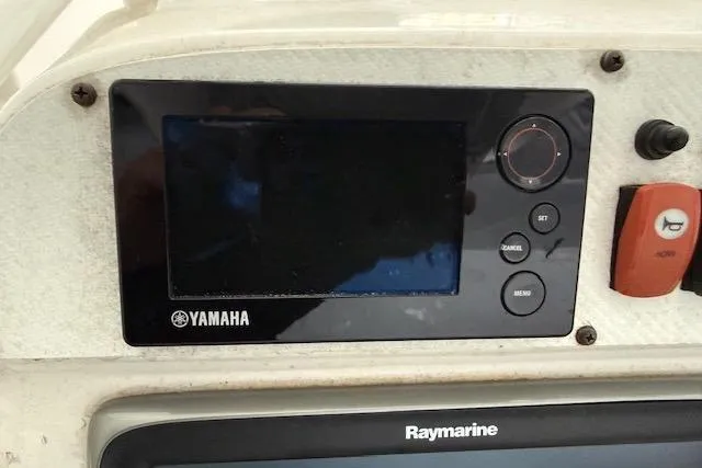 Slide: The Image of Yamaha and Raymarine displays on 2013 Everglades 230 Center Console boat dashboard. - 22