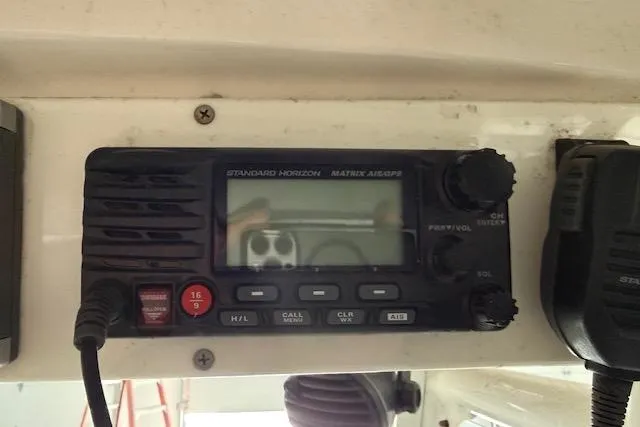 Slide: The Image of VHF radio on 2013 Everglades 230 Center Console boat dashboard. - 25
