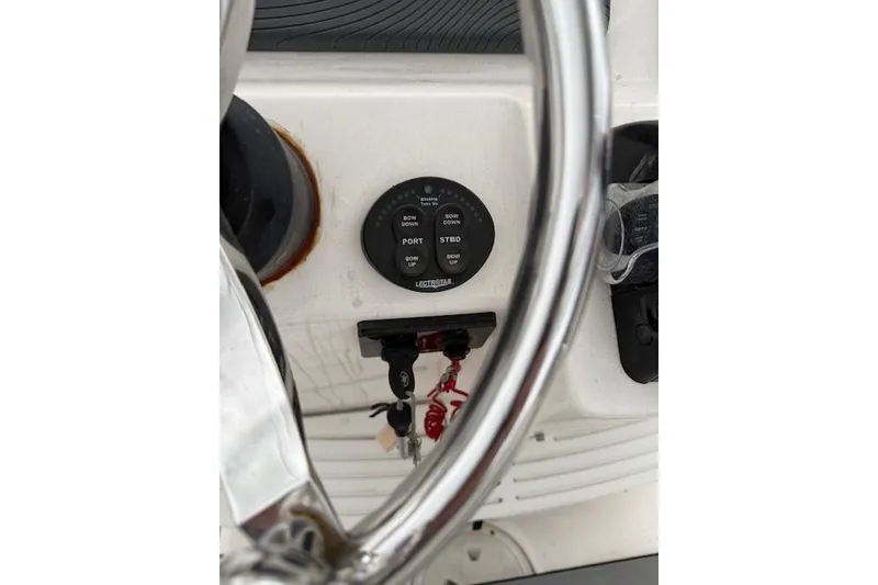Slide: The Image of Steering wheel and controls of 2013 Everglades 230 Center Console boat. - 27
