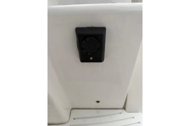 Slide: The Image of 2013 Everglades 230 Center Console boat detail with black electrical outlet. - 28