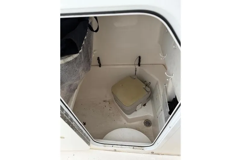 Slide: The Image of Interior of 2013 Everglades 230 Center Console boat with storage compartment. - 30