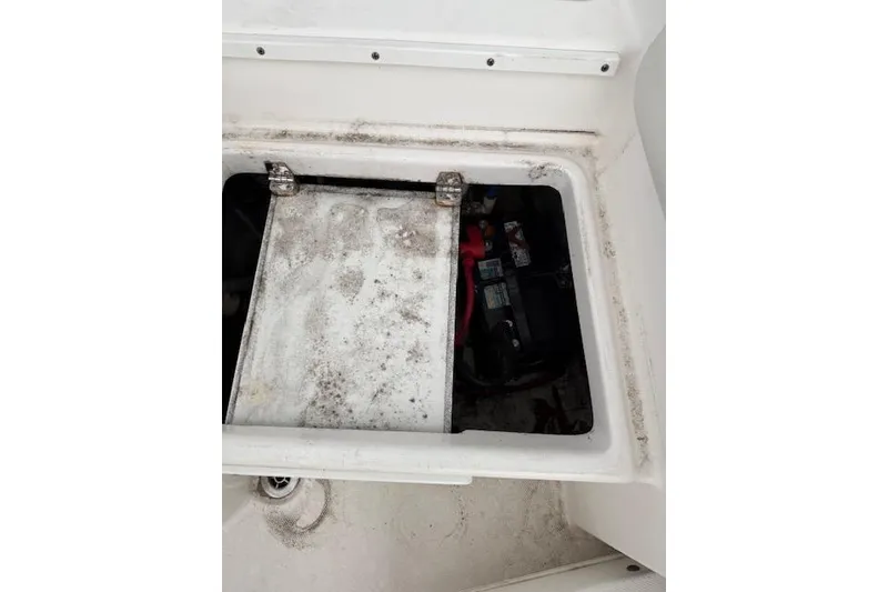 Slide: The Image of Open hatch of 2013 Everglades 230 Center Console boat showing battery compartment. - 36