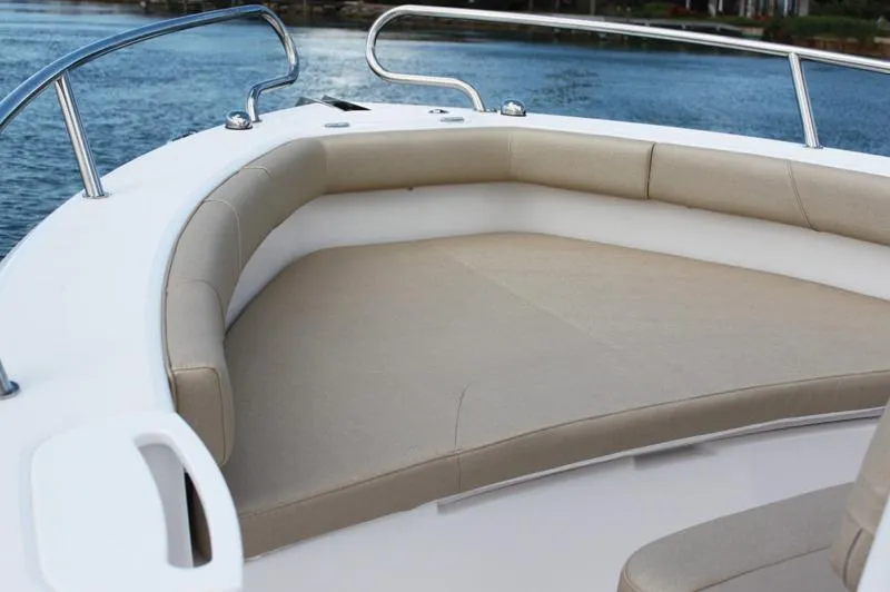Slide: The Image of Manufacturer Provided Image: 2015 Everglades 230 Center Console boat with cushioned seating area. - 42