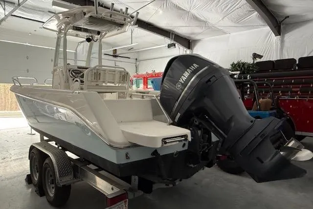 Slide: The Image of 2013 Everglades 230 Center Console boat with Yamaha engine in a garage. - 9