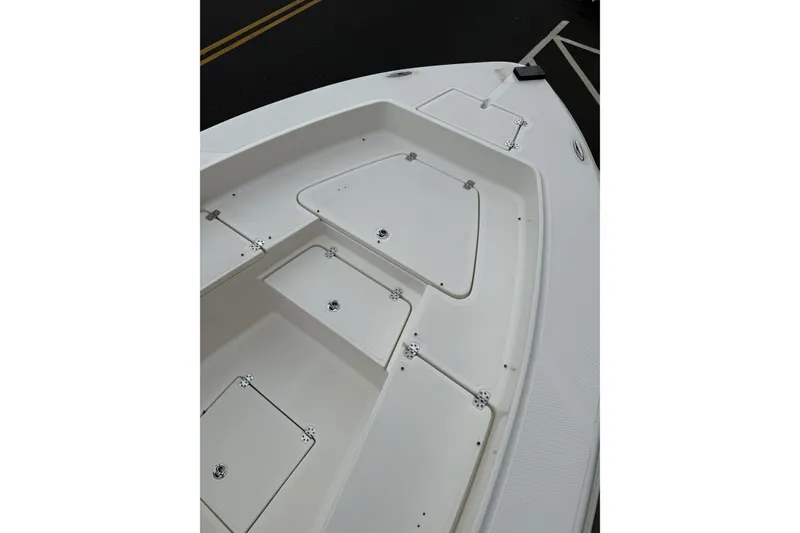 Slide: The Image of 2023 Pioneer 220 Bay Sport boat deck with storage compartments. - 13