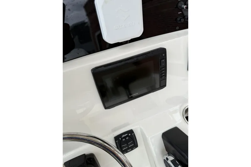 Slide: The Image of 2023 Pioneer 220 Bay Sport dashboard with Garmin display and Suzuki controls. - 20