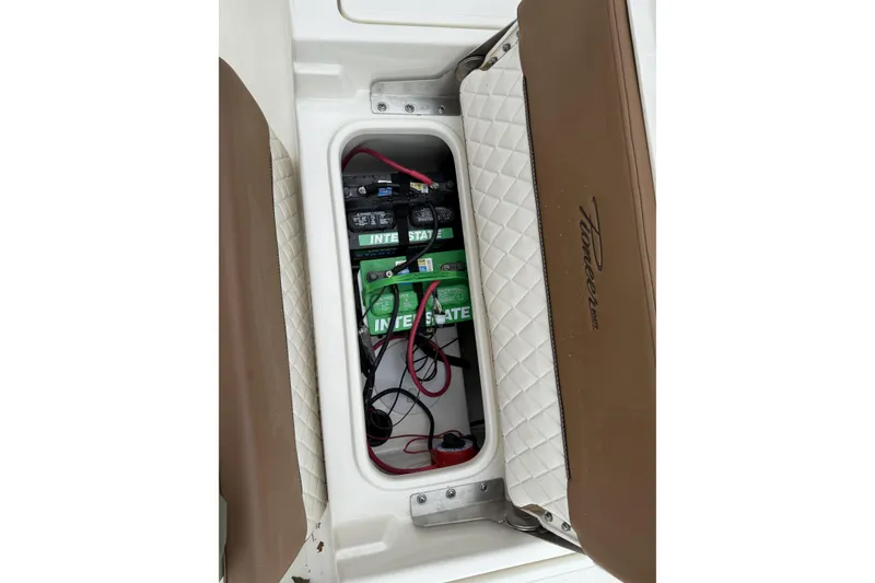 Slide: The Image of 2023 Pioneer 220 Bay Sport boat battery compartment with Interstate batteries and wiring. - 21
