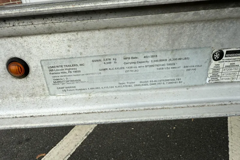 Slide: The Image of Label on Load Rite trailer, detailing specifications and manufacturing information. - 24