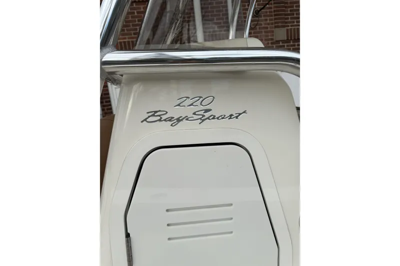 Slide: The Image of 2023 Pioneer 220 Bay Sport boat console with sleek design and chrome accents. - 26