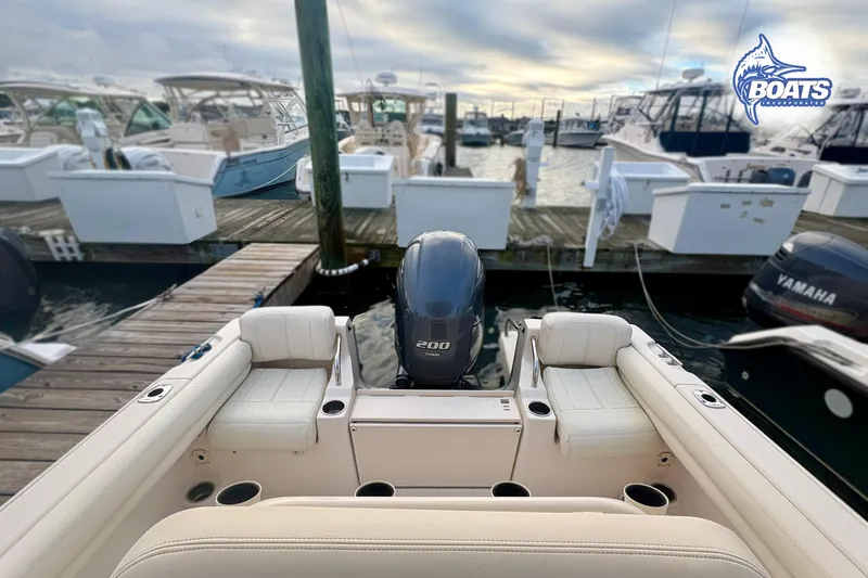 Slide: The Image of 2015 Grady-White Fisherman 209 boat docked, featuring Yamaha outboard motor. - 9