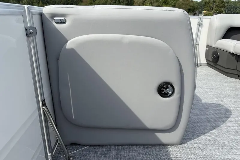 Slide: The Image of 2026 Sun Tracker Party Barge 18 DLX interior detail with gray upholstery and flooring. - 10