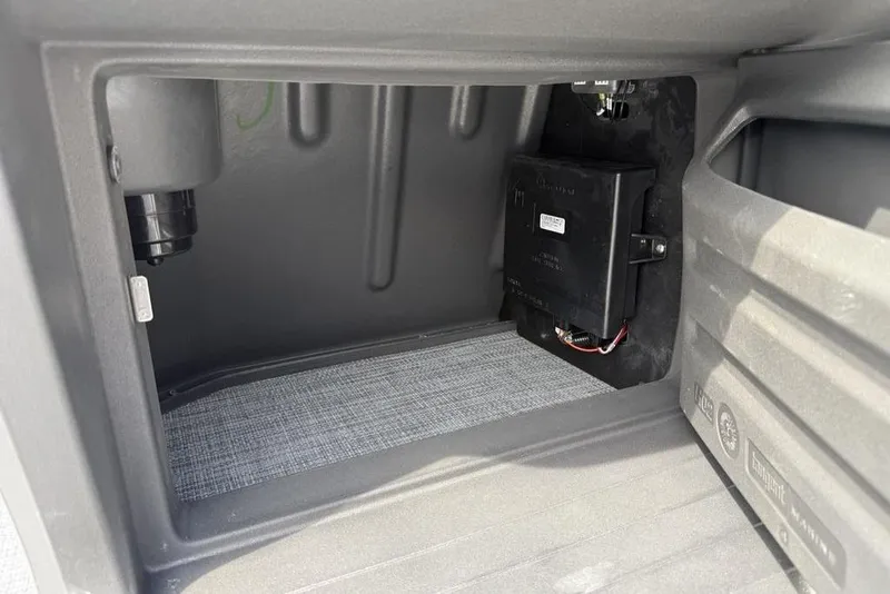 Slide: The Image of Storage compartment of 2026 Sun Tracker Party Barge 18 DLX with electrical components. - 20