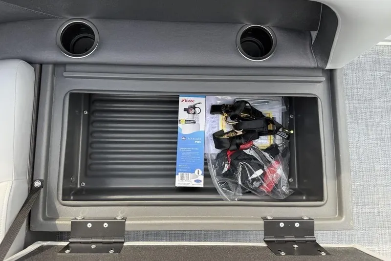 Slide: The Image of Storage compartment on 2026 Sun Tracker Party Barge 18 DLX with safety equipment. - 26