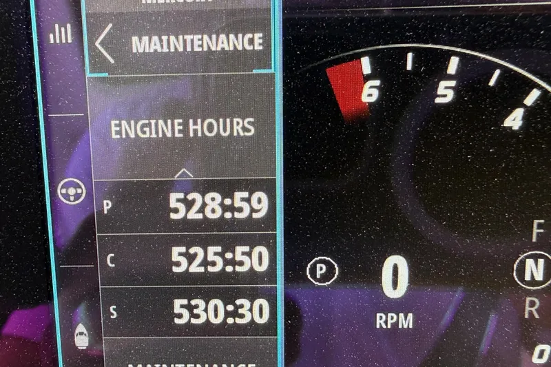 Slide: The Image of Dashboard display showing engine hours and RPM for 2022 Scout 355 LXF boat. - 42