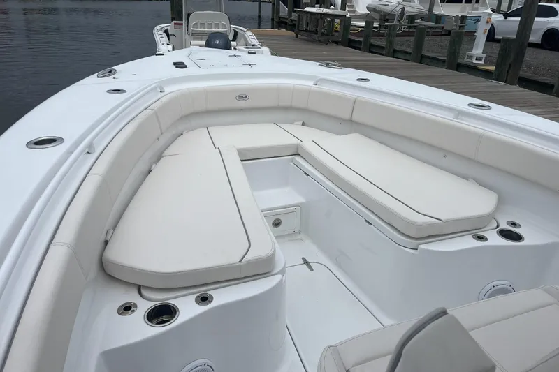 Slide: The Image of 2024 Sea Hunt Gamefish 30 Forward Seating boat with spacious white seating area. - 11