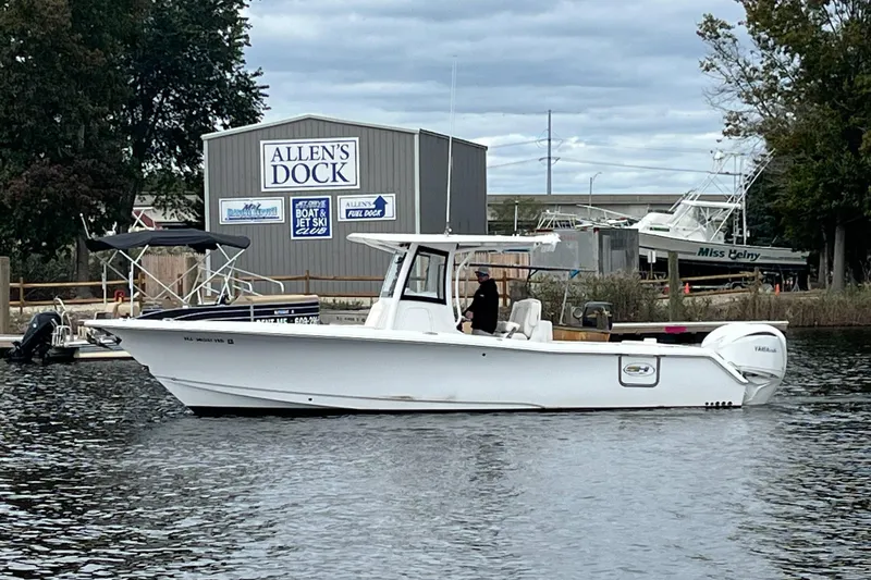 Slide: The Image of 2024 Sea Hunt Gamefish 30 boat at Allen's Dock, featuring forward seating. - 2