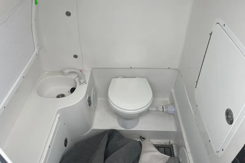 Slide: The Image of 2024 Sea Hunt Gamefish 30 boat bathroom with sink and toilet. - 20