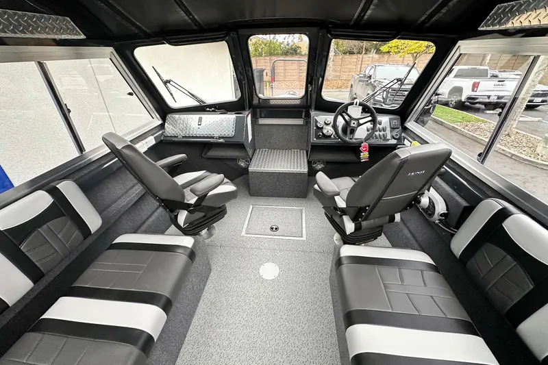Slide: The Image of Interior of 2026 Lund 210 Heavy Gauge boat with modern seating and controls. - 17