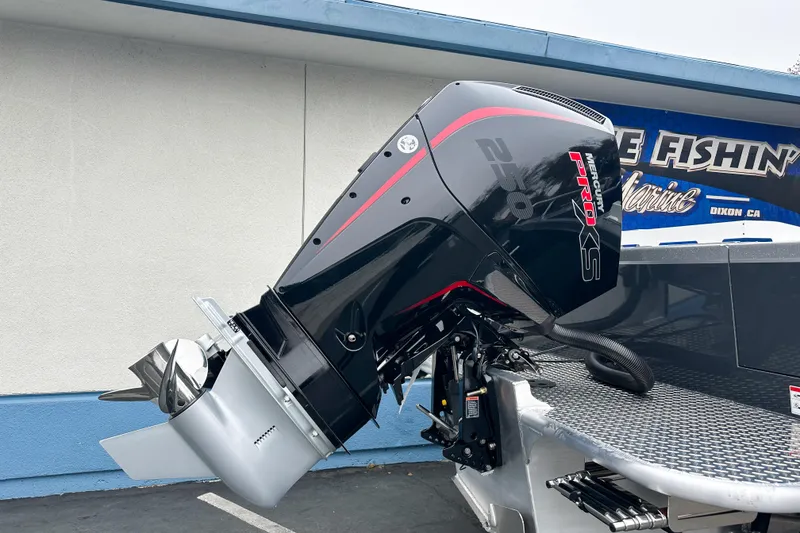 Slide: The Image of 2026 Lund 210 Heavy Gauge boat with Mercury Pro XS outboard motor. - 3