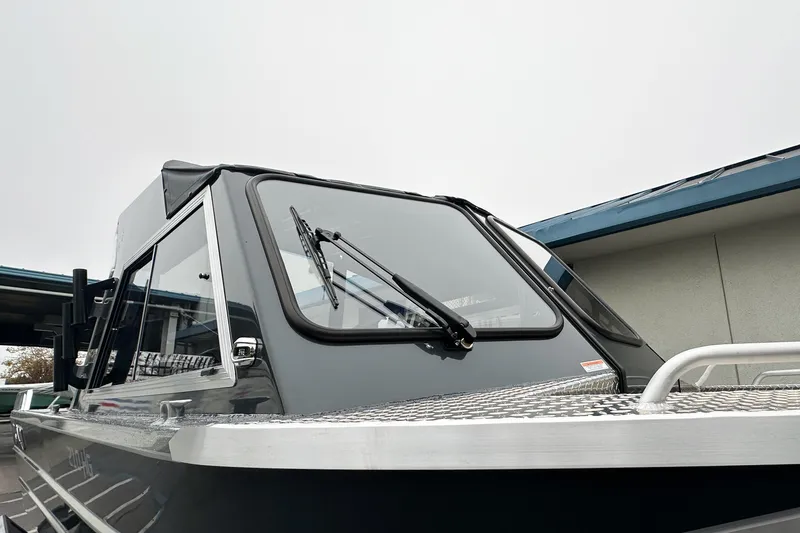 Slide: The Image of 2026 Lund 210 Heavy Gauge boat with sleek design and sturdy windshield. - 33