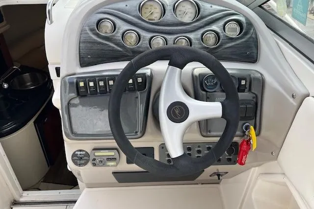 Slide: The Image of 2006 Monterey 250 Cruiser dashboard with steering wheel and control panel. - 7