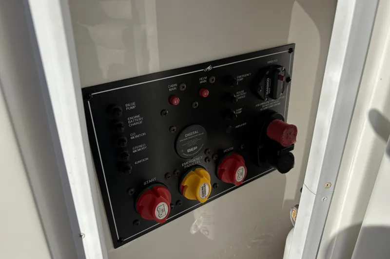 Slide: The Image of Control panel of a 2016 Monterey 295 Sport Yacht with various switches and dials. - 17