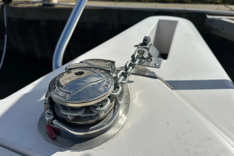 Slide: The Image of Anchor chain mechanism on a 1999 Intrepid 339 boat deck. - 12