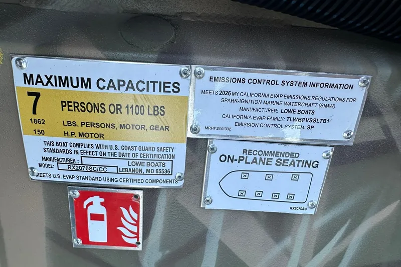 Slide: The Image of 2026 Lowe Roughneck 2070SC capacity and emissions labels, showing seating, weight, and safety information. - 24