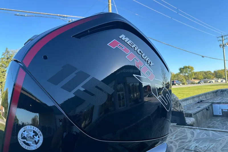 Slide: The Image of Mercury Pro XS 115 engine on 2026 Lowe Roughneck 2070SC boat, outdoors. - 25