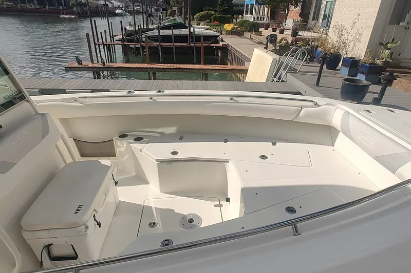 Slide: The Image of 2012 Boston Whaler 280 Outrage boat interior, docked by waterfront. - 19