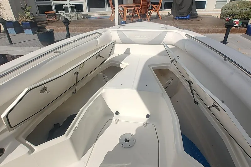 Slide: The Image of 2012 Boston Whaler 280 Outrage boat interior with open storage compartments. - 20