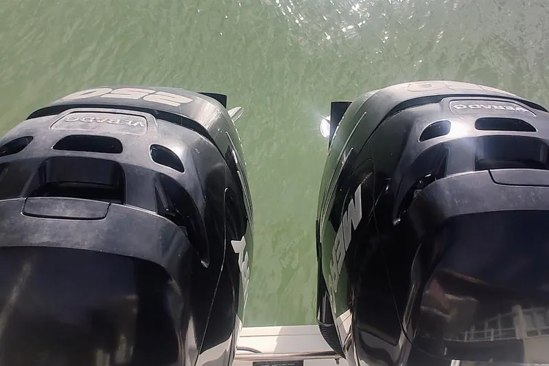 Slide: The Image of Twin Mercury Verado engines on a 2012 Boston Whaler 280 Outrage boat. - 23