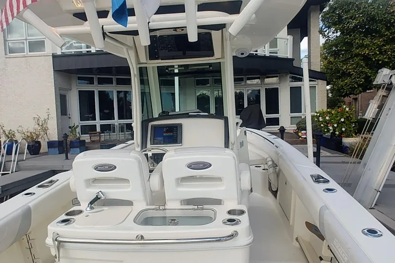 Slide: The Image of 2012 Boston Whaler 280 Outrage boat interior with helm and seating area. - 25