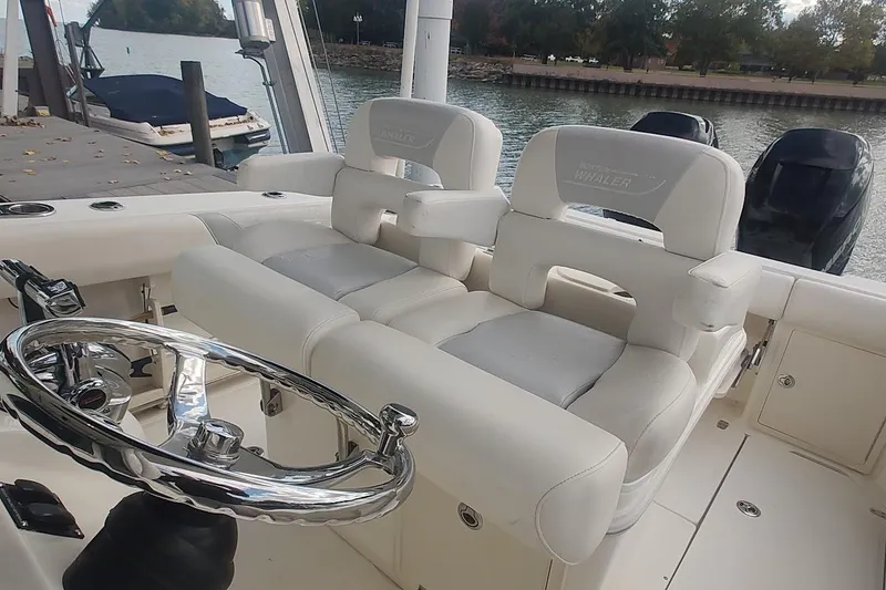 Slide: The Image of 2012 Boston Whaler 280 Outrage boat interior with dual seating and steering wheel. - 32