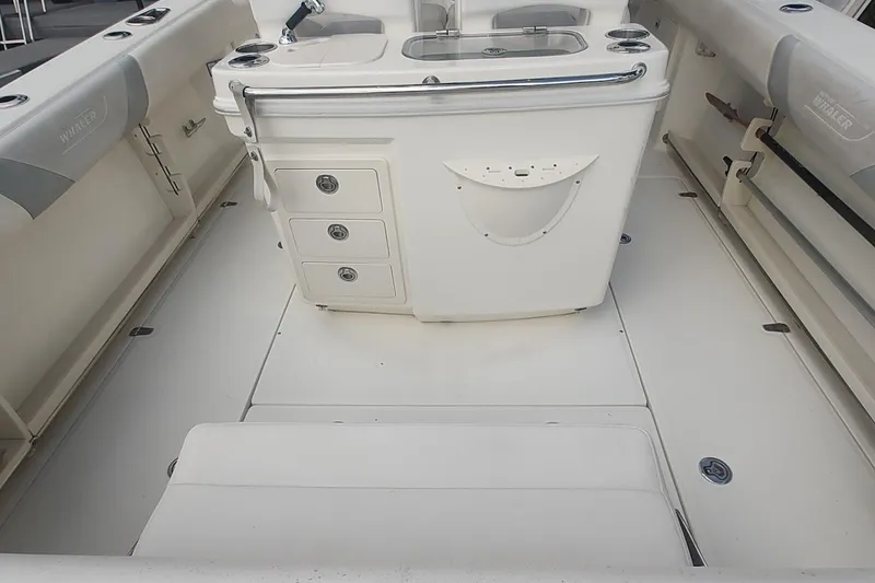 Slide: The Image of 2012 Boston Whaler 280 Outrage boat interior with storage and seating. - 37