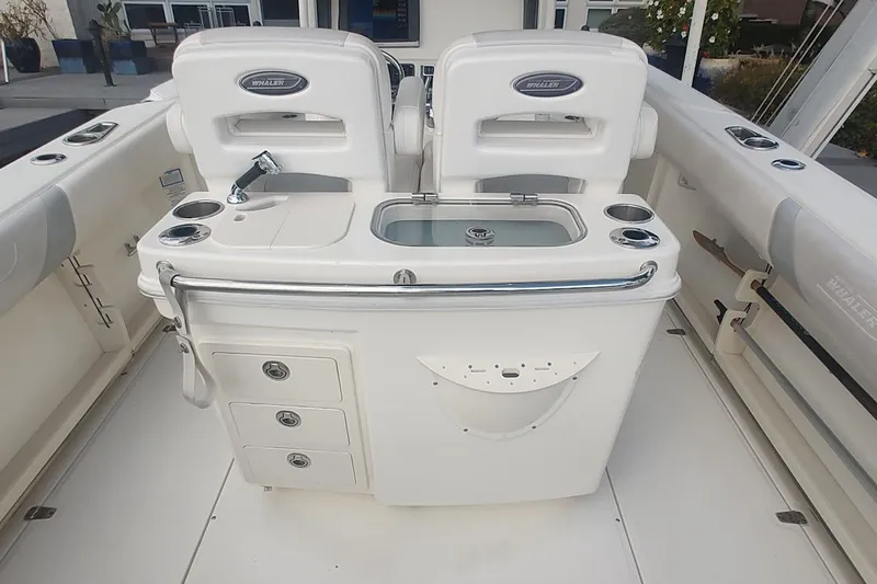 Slide: The Image of 2012 Boston Whaler 280 Outrage boat interior with seating and storage compartments. - 38