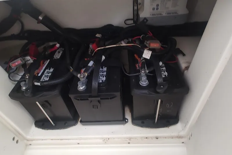 Slide: The Image of Batteries in a 2012 Boston Whaler 280 Outrage boat, neatly arranged and connected. - 43