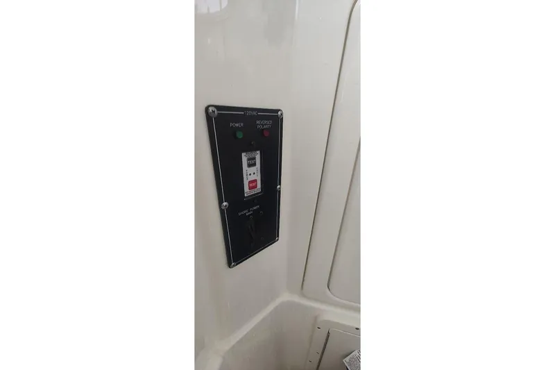 Slide: The Image of Control panel on a 2012 Boston Whaler 280 Outrage boat interior. - 45