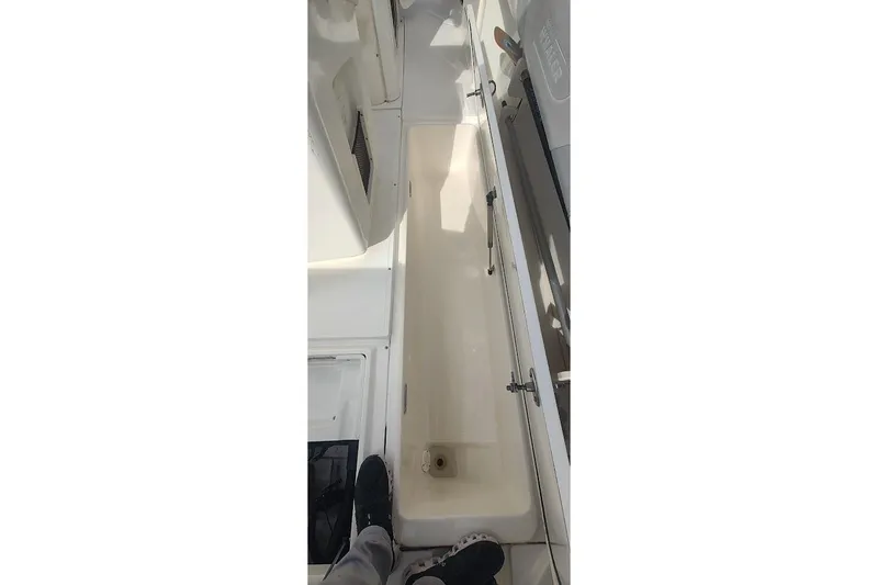 Slide: The Image of 2012 Boston Whaler 280 Outrage interior storage compartment view. - 47