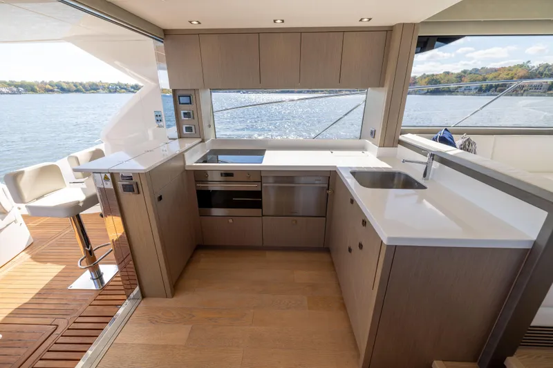 Slide: The Image of Modern kitchen interior on 2018 Sunseeker Manhattan 52 yacht with scenic water view. - 23