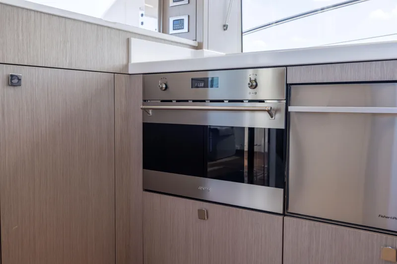 Slide: The Image of Modern kitchen interior on 2018 Sunseeker Manhattan 52 yacht, featuring sleek appliances. - 25