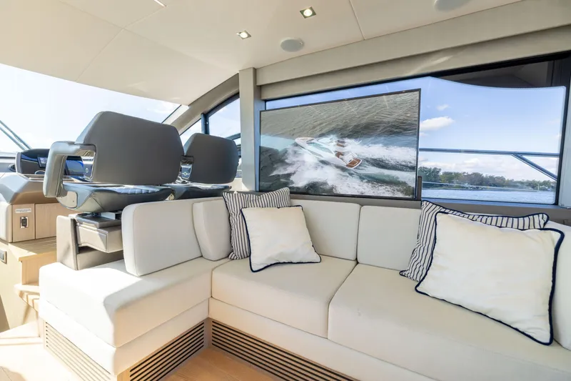 Slide: The Image of Luxurious interior of 2018 Sunseeker Manhattan 52 yacht with plush seating and scenic view. - 30