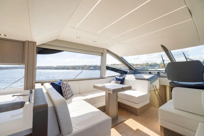 Slide: The Image of Luxurious interior of 2018 Sunseeker Manhattan 52 yacht with elegant seating and scenic water view. - 32