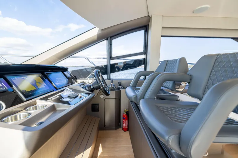 Slide: The Image of Luxurious 2018 Sunseeker Manhattan 52 yacht interior with modern helm and seating. - 34