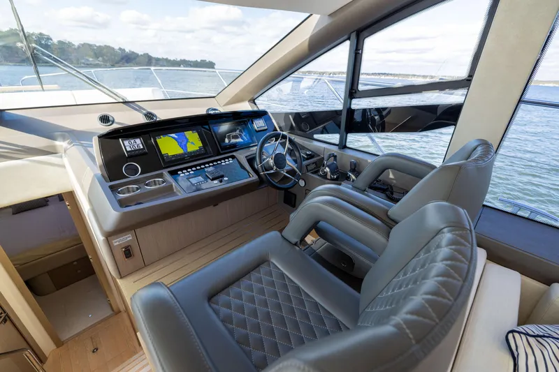 Slide: The Image of Luxurious 2018 Sunseeker Manhattan 52 yacht cockpit with modern navigation system and leather seating. - 35