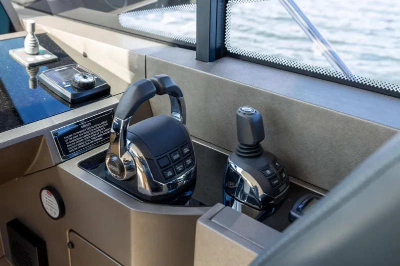 Slide: The Image of Control panel of a 2018 Sunseeker Manhattan 52 yacht, featuring modern navigation equipment. - 37