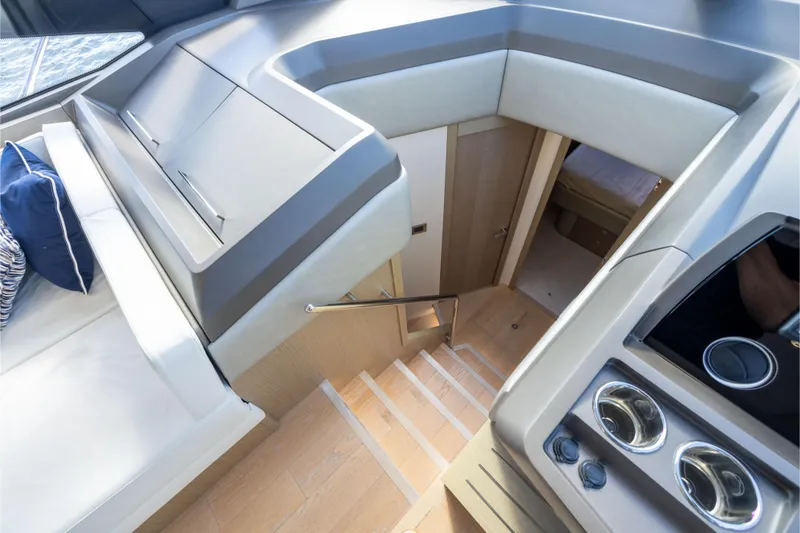Slide: The Image of Interior view of 2018 Sunseeker Manhattan 52 yacht, featuring modern design and wooden stairs. - 39
