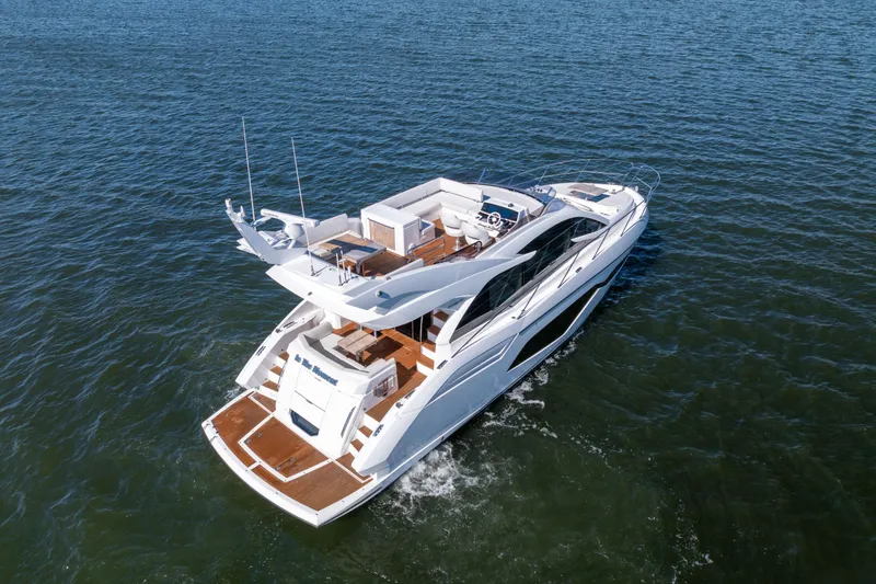 Slide: The Image of 2018 Sunseeker Manhattan 52 yacht cruising on open water. - 4